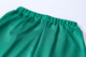 Unisex adult shorts in a vibrant green colour, made from 100% polyester with an elastic waistband.