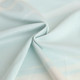 A light blue polyester and spandex fabric, showcasing a smooth texture and subtle pattern.