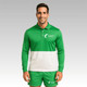 A model wearing a green and white long-sleeve polo with a logo. The outfit features a matching short set.