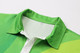 A vibrant green polo shirt with a white collar and a logo, featuring a subtle gradient design.