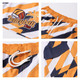 Women's board shorts featuring a vibrant orange and navy design, with a logo and a drawstring waist.
