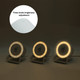 A night light speaker with wireless charger in white, featuring adjustable brightness levels and a logo.