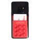 A red silicone phone wallet featuring popper stress reliever bubbles attached to a smartphone with a card inserted.