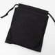 A black drawstring pouch with a textured surface and open top, designed for storage or carrying items.