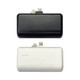 A power bank stand with a black and a white unit, each featuring built-in connectors and a logo.