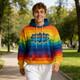 A unisex adults hoodie featuring a vibrant rainbow design with a logo. It has a blue hood and is made of polyester spandex.