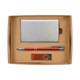A gift set including a metallic cardholder, an orange pen, and a USB flash drive, all presented in a cardboard box.
