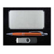 A sleek silver gift box containing a metallic pen, a USB flash drive, and a card holder.