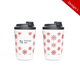 A double-walled coffee cup featuring a white background with red snowflake designs and a black lid. It has a logo.