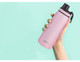A drink bottle in a sleek pink colour, featuring a screw cap and a brand logo.