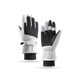 Ski gloves in white and black, featuring a textured grip and adjustable wrist straps. Branding present on the gloves.
