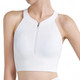 A white zip-front racerback yoga crop bra tank with ribbed texture and a subtle logo.