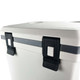 A cooler box with a grey exterior featuring black latches and a sleek design. It includes a branding logo.