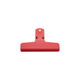 A red plastic clip with a hole for hanging and a flat grip surface. It features a logo on the front.