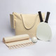 A drink bottle, two paddles, a ball, a towel, and a cream tote bag, all featuring a simple design.