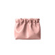 A zipperless portable makeup bag in soft pink, featuring a gathered design and smooth finish.