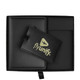 A black gift box contains a black luggage tag and a cardholder with a logo.