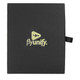 A black travel gift set box featuring a logo, designed for luggage tags and travel accessories.