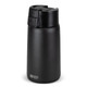 A drink bottle with a sleek black exterior, featuring a secure lid and a small logo.