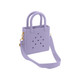 A mini beach bag in lavender with handles and a detachable strap, featuring holes and a simple design.