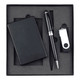A black power bank, USB drive, and pen arranged in a black gift box. The set is neatly positioned on grey foam.