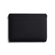A black laptop sleeve with a smooth, minimalist design and a subtle logo. Suitable for 16-inch laptops.