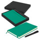 A green Moleskine notebook and black pen in a black gift box. The notebook has a ribbon bookmark and an elastic closure.