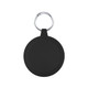 A round black keychain holder features a silver keyring. The surface is smooth with subtle grooves around the edge.