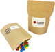 A compostable bag containing colourful M&Ms spilling out, with a simple natural kraft design and a logo.