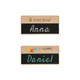 Two wooden chalkboard name badges, featuring a light wood finish with black erasable chalkboard areas.