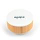A round speaker and wireless charger with a white top and bamboo base, featuring a logo on the surface.
