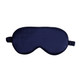 A satin sleep mask in navy blue with an elastic strap and a smooth texture. It features a logo on one side.
