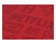 A red notebook cover features debossed design elements related to film and streaming. It includes a branding logo.