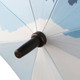 A blue and white eight-panel umbrella with a black handle and a branding logo on the shaft.