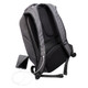 A grey anti-theft backpack with adjustable straps, featuring a charging port and a smartphone beside it.