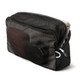 A black mesh packing cube containing various items, showcasing its organisational features and content visibility.