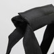 A black strap featuring durable fabric, designed for carrying or securing items.
