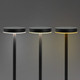 Three black rechargeable table lamps with round tops and adjustable light settings against a grey background.