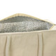 A cream-coloured cooler tote with a silver insulated interior and sturdy handles. It has a zippered opening.