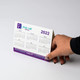 A desk calendar featuring months from January to June, with a predominantly white background and purple accents.