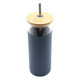 A drink bottle with a dark grey body, bamboo lid, and metal straw. It features a logo on the side.