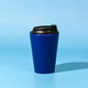 A blue 350mL coffee mug with a black lid, featuring a logo on the side.