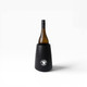 A black wine cooler holds a bottle of wine, featuring a circular logo on the front.