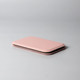 A pink pocket mirror with a slim, rectangular design, featuring a smooth surface and rounded edges.