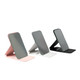 A set of three pocket mirrors in pink, white, and black, each with a sleek design and a logo.