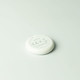 A white circular tracker with a branding logo, featuring a flat design on a light background.