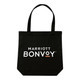 A black tote bag with two handles and a logo featured prominently on the front.