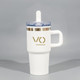 A drink bottle with a white body, gold accents, a clear lid, and a straw. It features a logo.