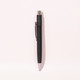 A metal ballpoint pen in black, featuring a clip and a silver tip, with a logo on the barrel.