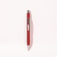 A red ballpoint pen with a silver clip, featuring a sleek design and a shiny finish.